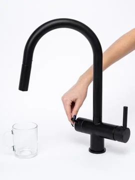 Modern pull-down kitchen faucet on white background Stock Photos