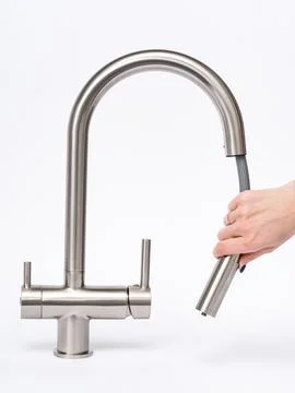 Modern pull-down kitchen faucet on white background Stock Photos
