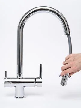 Modern pull-down kitchen faucet on white background Stock Photos
