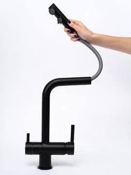 Modern pull-down kitchen faucet on white background Stock Photos