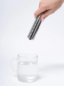Modern pull-down kitchen faucet on white background 写真素材