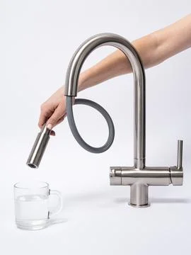 Modern pull-down kitchen faucet on white background Stock Photos