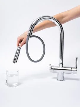 Modern pull-down kitchen faucet on white background Stock Photos