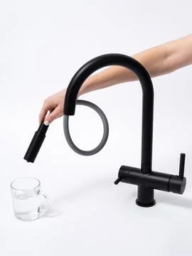 Modern pull-down kitchen faucet on white background Fotos Stock