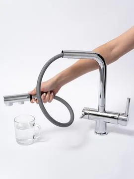 Modern pull-down kitchen faucet on white background 写真素材