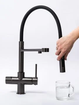 Modern pull-down kitchen faucet on white background Stock Photos