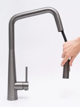 Modern pull-down kitchen faucet on white background Stock Photos