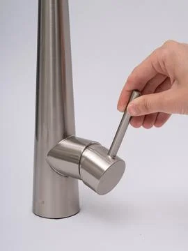 Modern pull-down kitchen faucet on white background Stock Photos