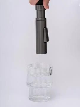 Modern pull-down kitchen faucet on white background Stock Photos