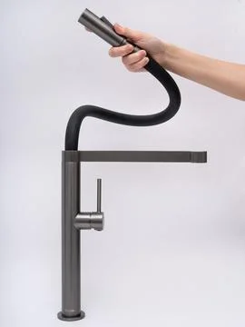 Modern pull-down kitchen faucet on white background Stock Photos