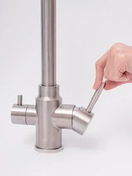 Modern pull-down kitchen faucet on white background Stock Photos