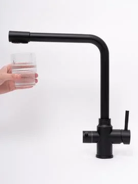 Modern pull-down kitchen faucet on white background Stock Photos