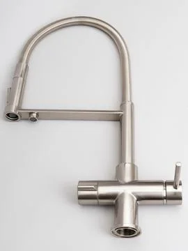 Modern pull-down kitchen faucet on white background 写真素材