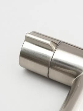 Modern pull-down kitchen faucet on white background 写真素材