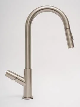Modern pull-down kitchen faucet on white background Stock Photos