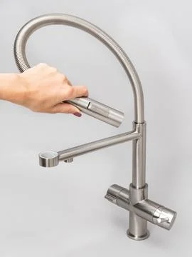 Modern pull-down kitchen faucet on white background Foto stock