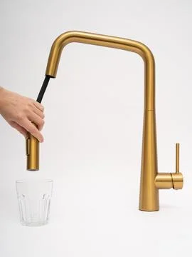 Modern pull-down kitchen faucet on white background Stock Photos