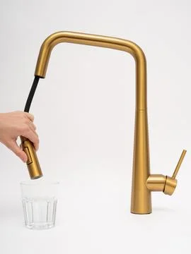 Modern pull-down kitchen faucet on white background Stock Photos