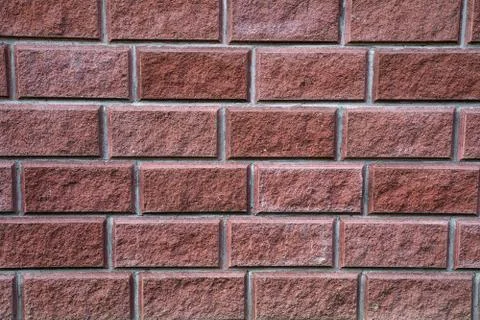 Modern red brick wall texture for loft interior or exterior. Stock Photos
