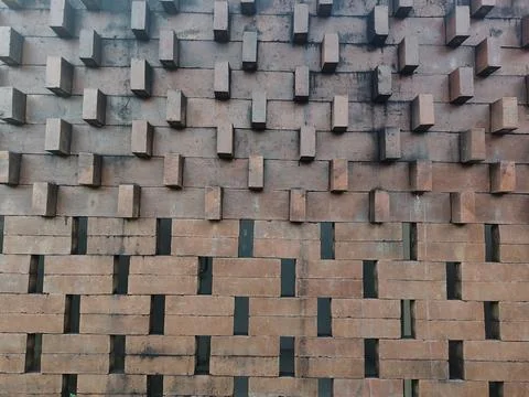 Modern red brick wall texture with a unique geometric 3D pattern Stock Photos