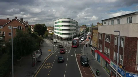 Modern red double decker driving in street of urban neighbourhood Video stock 161291464