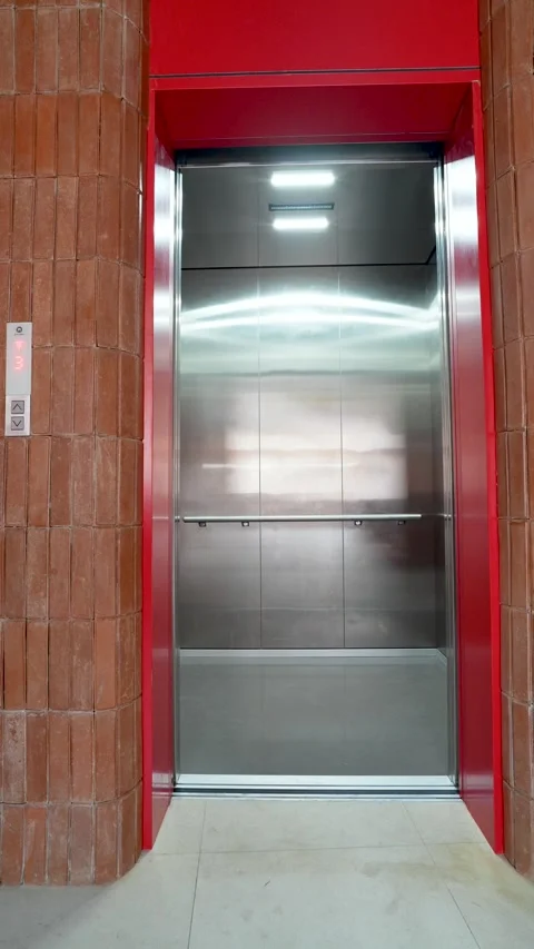 Modern red elevator doors open and close. Stock Footage 341555242