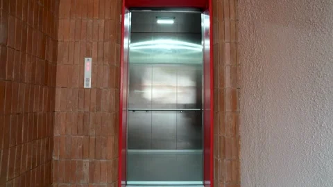 Modern red elevator doors open and close. Stock Footage 341555268