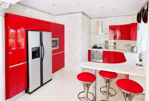 Modern red kitchen interior Stock Photos