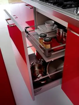 Modern red kitchen opened drawer detail Stock Photos
