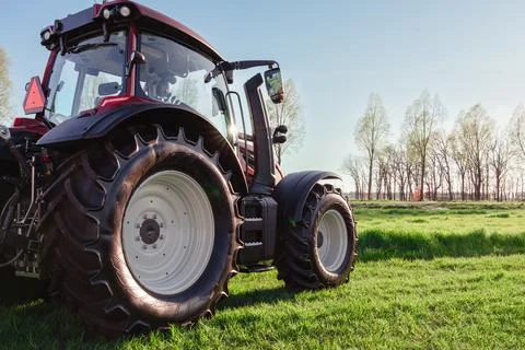 Modern Red Tractor Ready For Work In The Field Stock Photos