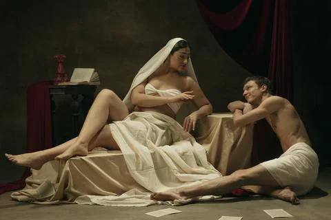 Modern remake of classical artwork - young medieval couple on dark background Stock Photos