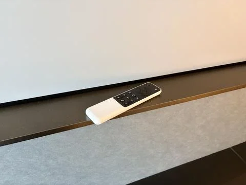 Modern Remote Control on Minimalist Surface Foto stock