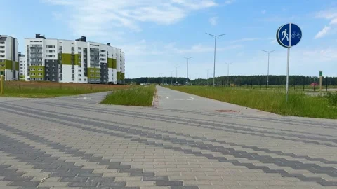 A modern residential area with a shared pedestrian and bicycle path Stock Footage 338179288