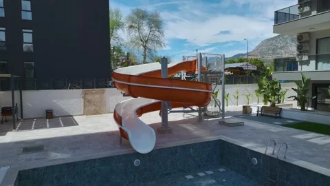 Modern residential complex with pool and waterslide in Turkey Stock Footage 342823208