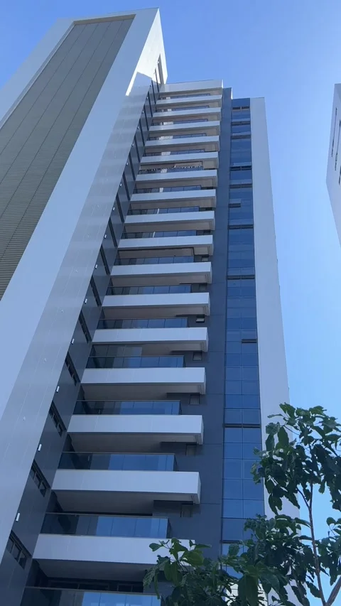 Modern residential skyscraper facade tilt down in Salvador Brazil Видео 343581285