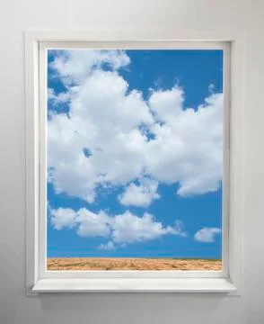 Modern residential window with a view of clouds and field Stock Photos