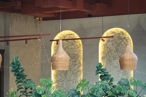 Modern restaurant interior with decorative wicker pendant lights Photos
