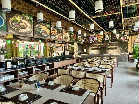 Modern restaurant interior featuring professionally set dining tables Stock Photos
