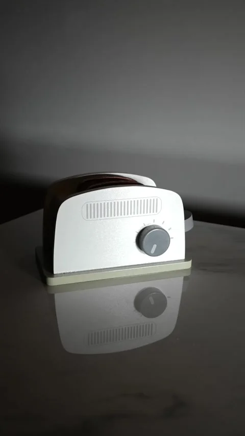 Modern Retro Toaster Placed on a Reflective Marble Surface Video stock 325629431