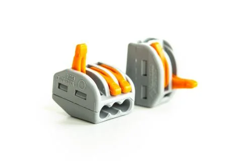 Modern reusable electrical terminals on white background Stock Photos