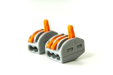 Modern reusable electrical terminals on white background Foto stock