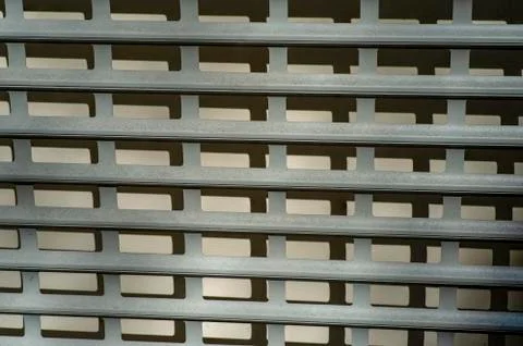 Modern rhythmic pattern sliding metal blinds for protection. Long banner Stock Photos