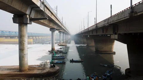 Modern Road Bridge Spanning Contaminated River with Toxic Foam and workers boat Stock Footage 295908106