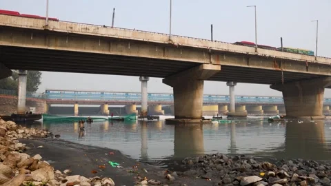 Modern Road Bridge Spanning Contaminated River with Toxic Foam and workers boat Stock Footage 295908367