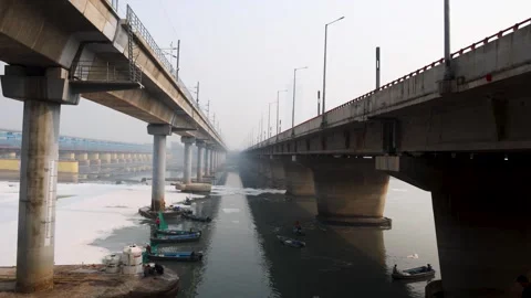 Modern Road Bridge Spanning Contaminated River with Toxic Foam at misty morning Stock Footage 295908840
