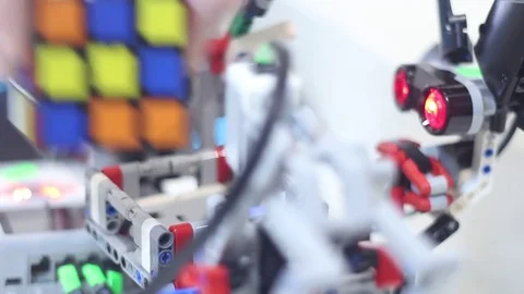 Modern robot with a color sensor collects Rubiks Cube Stock Footage 81787451