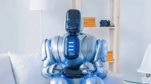 Modern robot sitting on the couch with cheerful woman Stock Footage 64311659