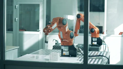 Modern robotic arms work in facility. Stock Footage 138021651