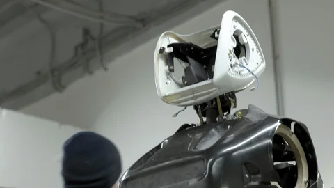 Modern Robotic Technologies. The engineer creates a modern robot or android Stock Footage 101366014