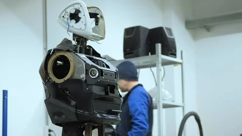 Modern Robotic Technologies. The engineer creates a modern robot or android Stock Footage 101368582